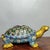 This is a striking and substantial vintage-style sculpture of a turtle, crafted using the traditional cloisonné enamel...