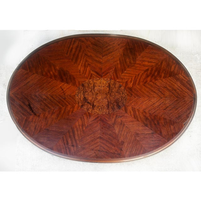 Mahogany Oval Parlor Table with Matched Veneer Top Supported by Turned Columns Offered for sale is an oval mahogany parlor...