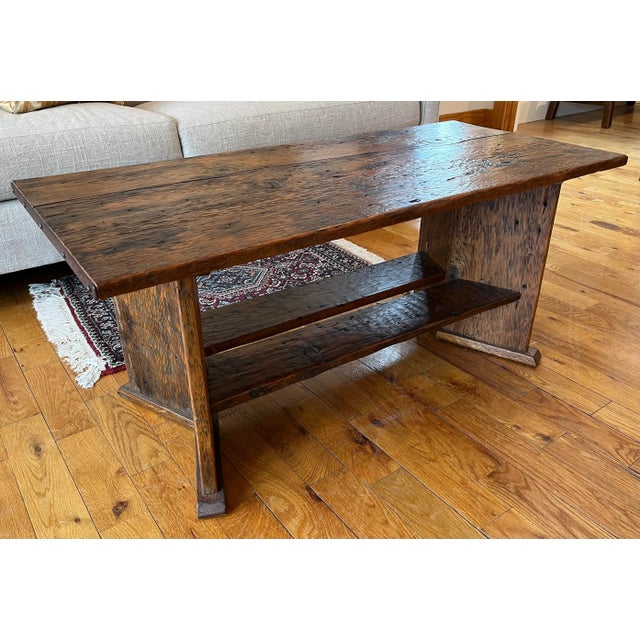 Custom Made Coffee Table. With V shaped legs and lower shelf. Reclaimed wood. Made by a local ME craftsman. There is a...