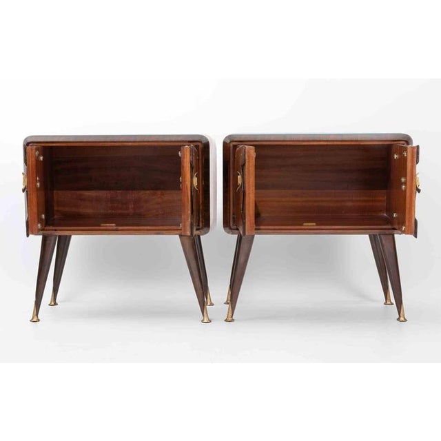 Vintage pair of night tables realized in Italy in 1950s. Wood glass tops with colored paper applied on the back, wood,...
