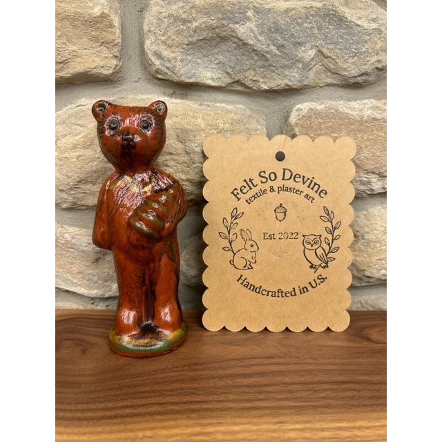 A stunning addition to any premium primitive collection, this standing holiday bear figurine brings early American...