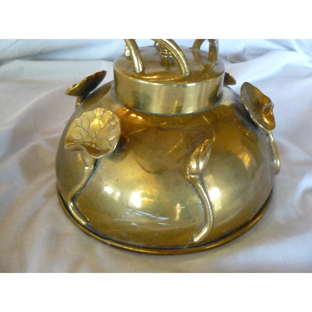 This petite side table is truly unlike any other I've ever seen! It's possibly solid brass, but may be plated so I'm...