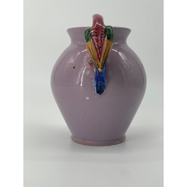 Charming vintage Italian pitcher with accenting colorful parrot handle. Solid lilac body with red, green, yellow, and blue...