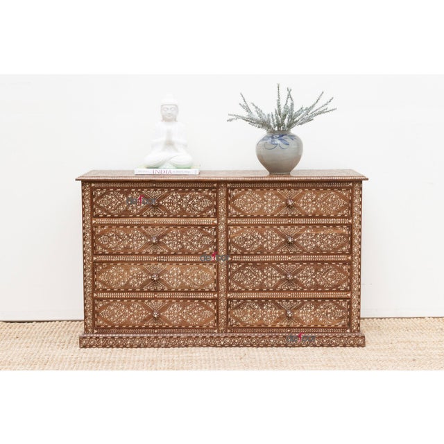 Introduce a sense of stately elegance to your bedroom with our beautifully inlaid dresser, a substantial piece offering...