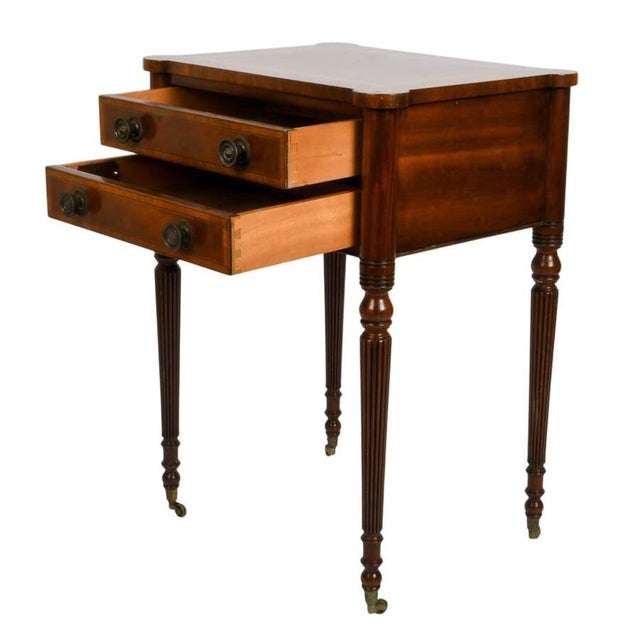 Expertly handcrafted by Trosby Furniture, this elegant two-drawer side table reflects the timeless refinement of Federal-...