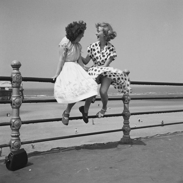 Blackpool Railings Premium Rates Apply. Two women chatting on the railings in Blackpool. The picture was taken by Bert...
