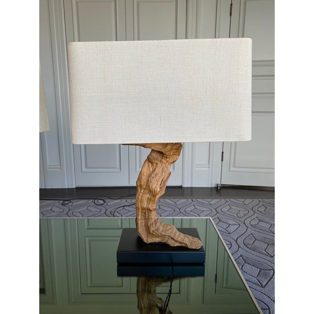 Beautiful vintage lamps made with a petrified driftwood. In original vintage condition except for the addition of a modern...