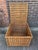 A beautiful large wicker basket with lid and side handles. It is made of thick woven wicker with wooden reinforcements and...