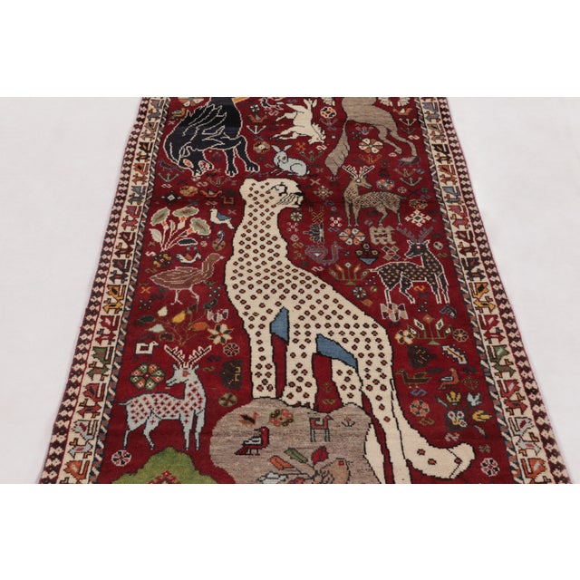 Hand-knotted in wool circa 1950-1960, this 3x9 vintage Persian Gabbeh runner is an enchanting entry in Rug & Kilim’s...