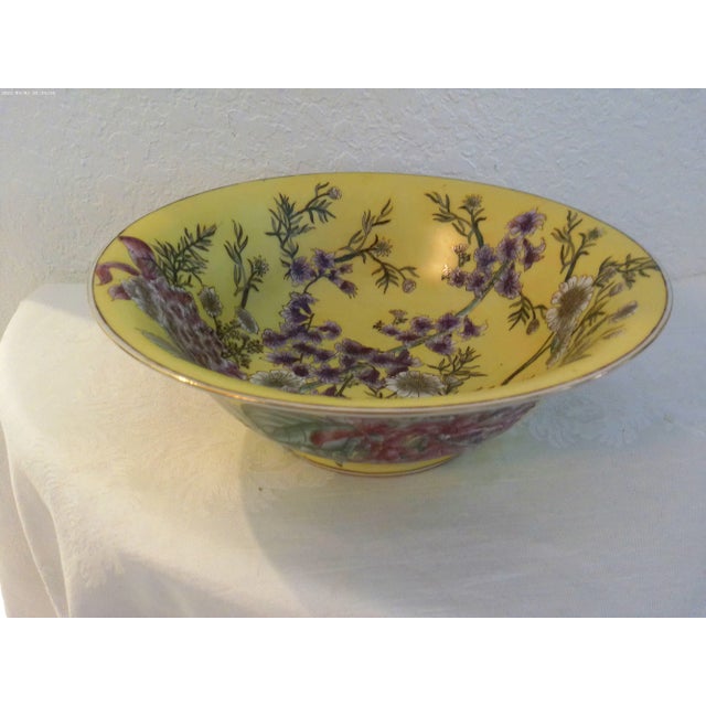 Beautiful large Chinese ceramic decorative bowl in yellow featuring a lovely floral motif interior and exterior of bowl in...