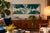 Each is hand-dyed batik on natural-fiber cloth, wrapped onto a panel and set in its original dark wood frame with plywood...