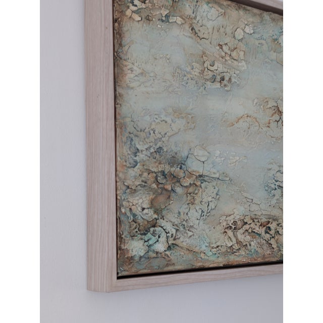 In Entropic Waters, the surface becomes a tide-worn map of dissolution and flow. Pale mineral tones and broken, crust-like...