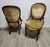 A refined pair of French Louis XV style fauteuil chairs, crafted in warm walnut with gently carved frames, rounded...
