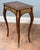 A decorative pair of Louis XV style side tables with shaped tops and floral marquetry inlay The tops are framed by...