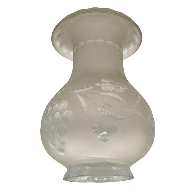 This vintage western-style white frosted glass oil lamp Hurricane Shade with wheel cut floral pattern has a smooth, curved...