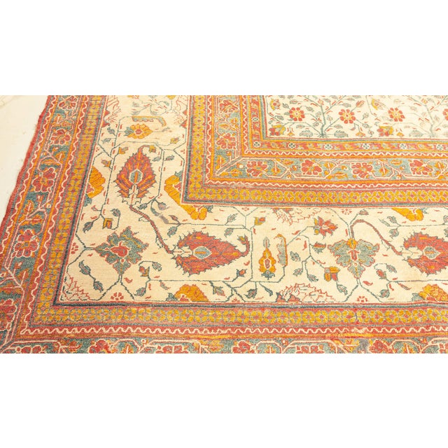 This stunning 1920s oversized Indian Agra rug is a remarkable testament to the artistic grandeur and technical mastery of...