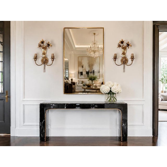 An exceptionally elegant and highly decorative pair of italian gilt-metal wall sconces by passeri international,...