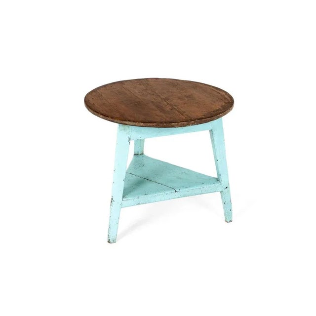 A simply wonderful early 19th-century cricket table of large form with a pale blue painted base. Circular pine plank top...