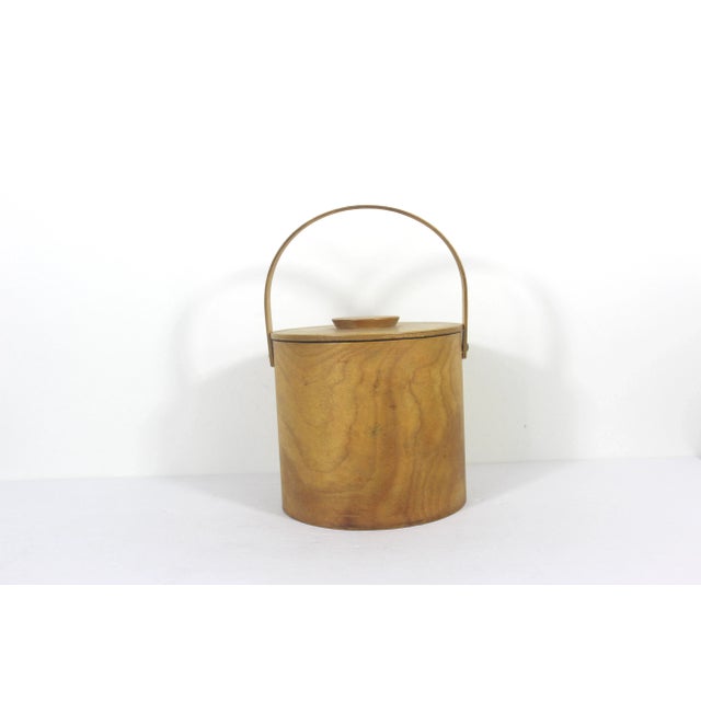 Vintage wood biscuit barrel or pail with handle and lid. Painted on the front with the word Biscuits and images of...