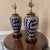 Pretty and unusual pair of Asian style abstract paired ceramic lamps. Abstract Hand painted design with brass like borders