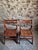 This set of two vintage French folding chairs dates from the 1970s and is crafted from solid beech wood. The design is...
