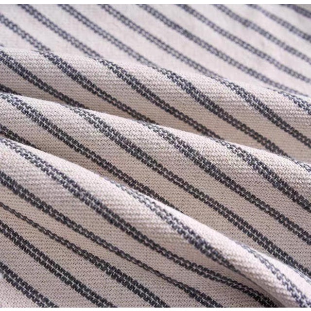 Our Classic Boho Stripe Pillow perfectly balances a sense of structure with an organic feel. The clear black and white...