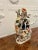 Antique 19th century staffordshire flatback figure with a spill vase to the top depicting two lovers in period costume...
