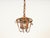 Marvelous mid-century french riviera style pendant made from a gorgeous combination of curved rattan, bamboo, and hand-...