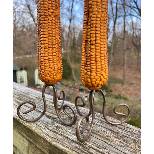 I find it impossible to look at these without smiling. A whimsical pair of handmade candlesticks with ceramic corn cobs on...