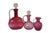 Six mid to early century cranberry art glass serving pieces featuring an English Victorian decanter with polished pontil...