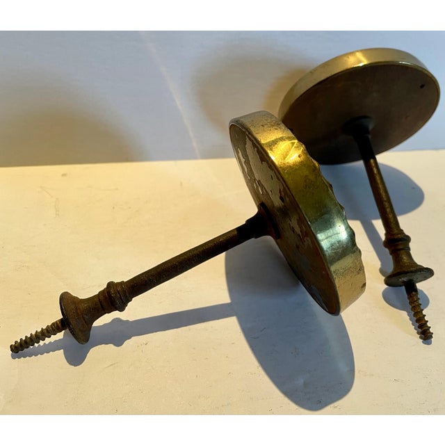 Pair of late 19th century antique brass curtain tiebacks. Original condition.