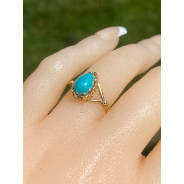 The Sandpiper Lane: Vintage Mid Century Yellow Gold Turquoise Ring. At the core of this design rests a pear-shaped...
