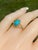The Sandpiper Lane: Vintage Mid Century Yellow Gold Turquoise Ring. At the core of this design rests a pear-shaped...
