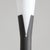 A floor lamp with a slender, minimalist design, characterized by a central black metal stem with a base of three thin...