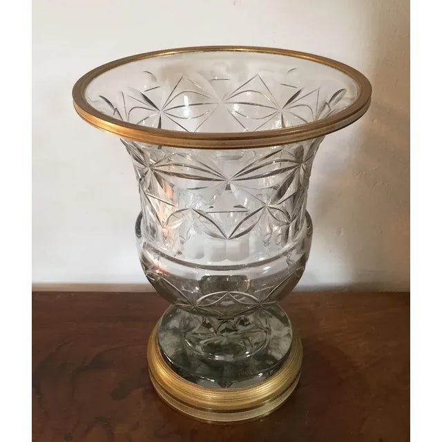 Large antique 19th c. Anglo Irish cut crystal urn mounted with French gilt bronze collar & base. The interior of the base...