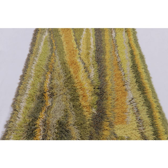 Hand-knotted in lush, high-pile wool in Sweden circa 1960–1970, this 4x6 vintage Rya rug is a soulful new addition to Rug...