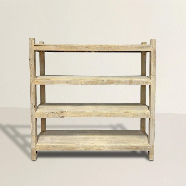 Some pieces whisper; this one practically disappears, and does so with intention. This late 20th-century French bookshelf...