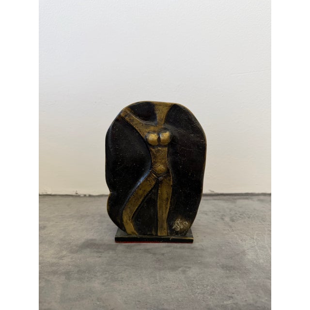 Modern sculpture of female torso carved from a round piece of bronze on bronze base. Signed by unknown artist circa 1980s.