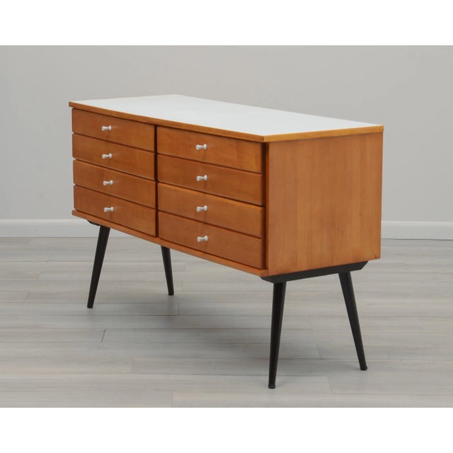 A rare Mid Century Interplay dresser or credenza designed by Marc Berge for Berge Norman. Maple with a white laminate top...