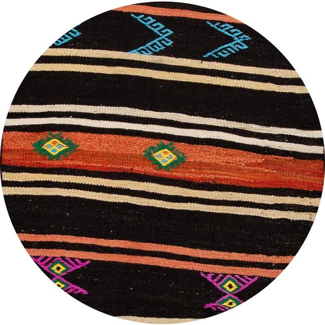 A beautiful vintage kilim runner with an all-over multi-color motif. This piece has fine details, great colors, and...
