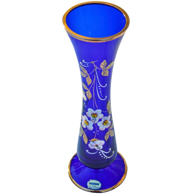 Midcentury handblown blue glass vase with ornate hand-painted colorful floral pattern and intricate textured details....