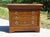 Beautiful chest of drawers in a honey-gold color, with four drawers, one of which is curved. Gilt bronze handles and...
