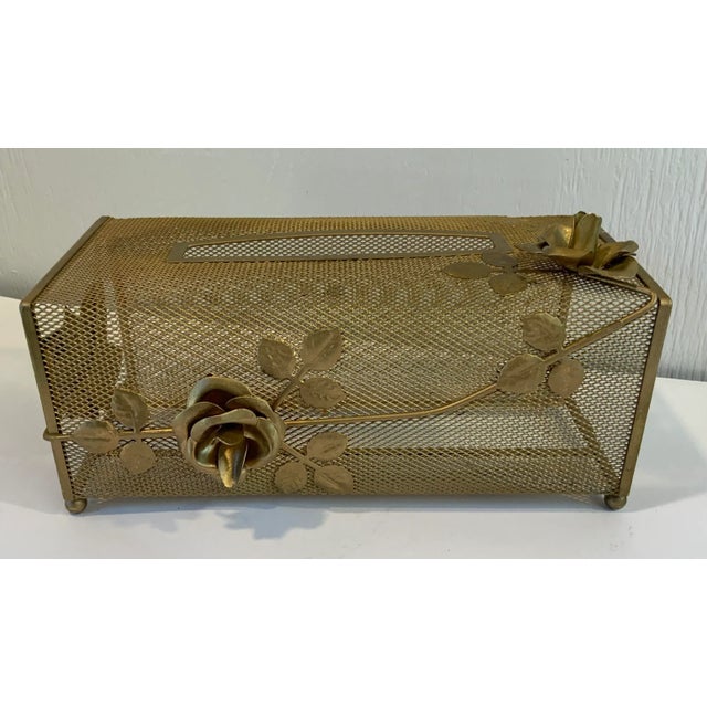 Nice Hollywood Regency gold metal mesh tissue box cover with rose details.