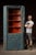 Primitive corner cupboard in worn blue paint over red wash, with true hand-cut joinery and panel doors. This cabinet is a...