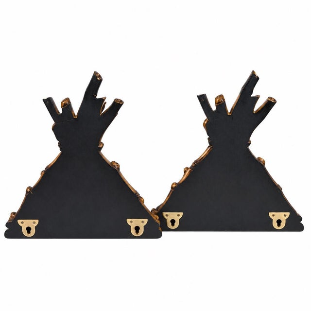 This is a pair of late 20th century Hollywood Regency style faux bamboo composition wall brackets. They are depicted as...