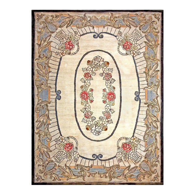 Amazing Ivory Ground Color Wiht Flower Details in the Center in a Medallion/Crest Design American Hooked Rug For Sale