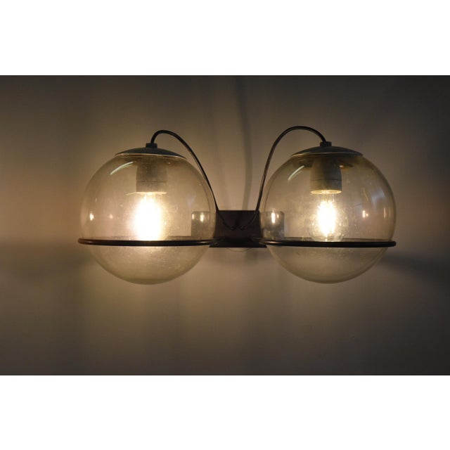 Set of two large wall lamps, model 238/2, by Gino Sarfatti for Arteluce, with manufacturer's label. Clear glass globes and...