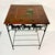 This is a delightful Southwestern Americana Metal and Wood Side Table. The metal frame features an apron with three cutout...