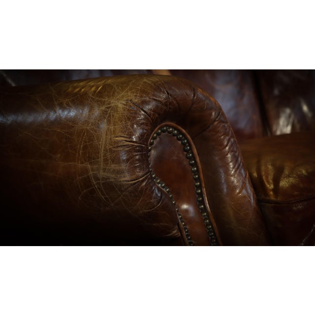 Up for grabs here is an absolutely stunning sofa and armchair by timothy oulton by timothy oulton in antique whisky tan. a...