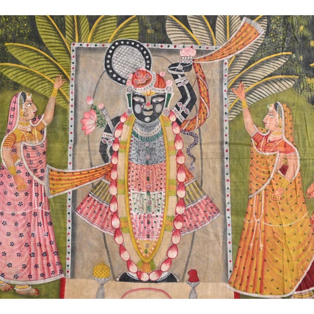 Within the realm of artistry and devotion, this Pichwai Painting of Lord Shreenath Ji stands as a testament to intricate...